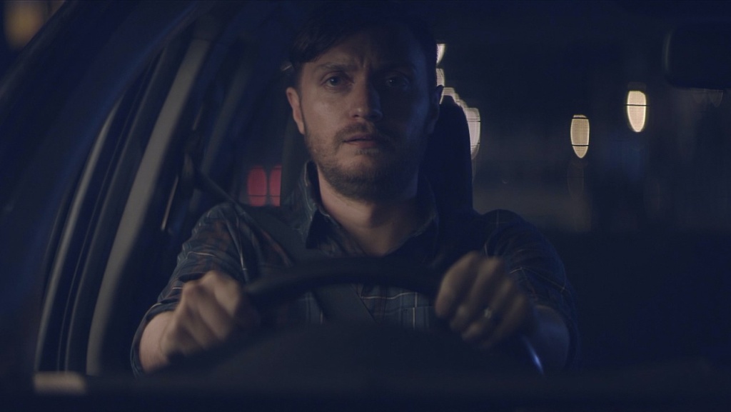 Man driving car for behaviour change TVC campaign.