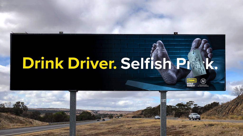 Billboard of a dead persons feet on a morgue table for SAPOL drink driving behaviour change campaign.