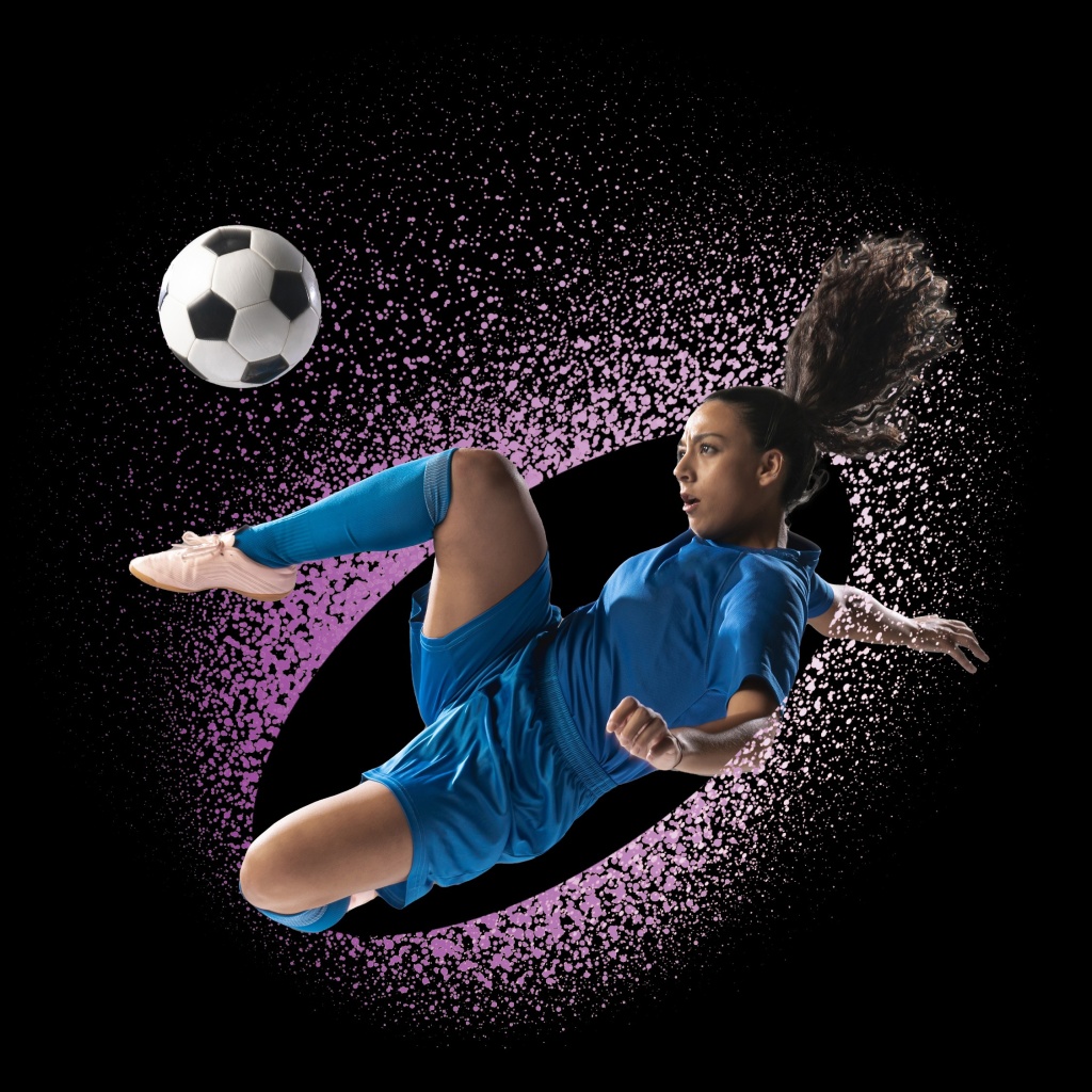 Woman kicking ball for brand development agency Adelaide.