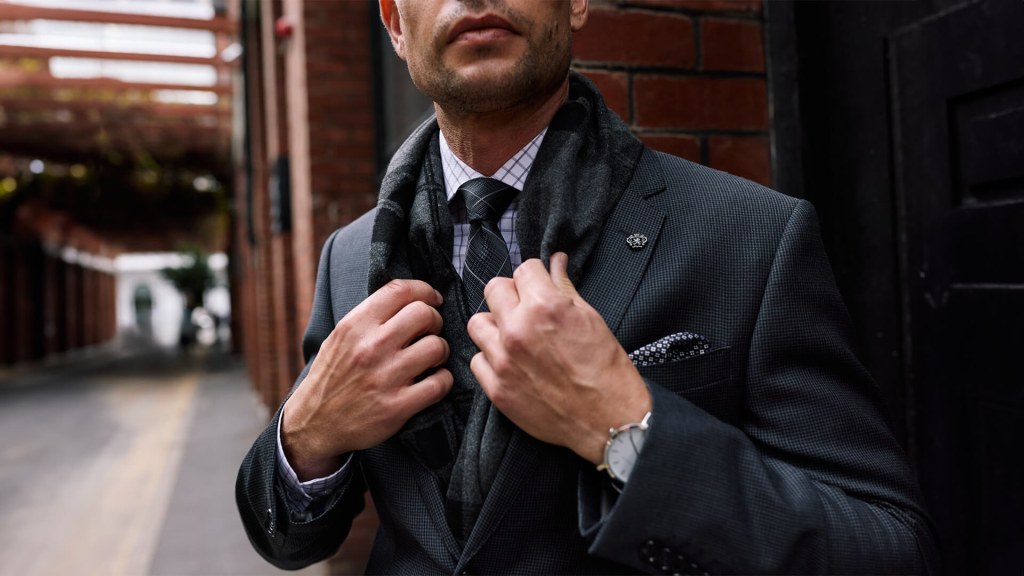 Man in suit and scarf for brand positioning high end photography.