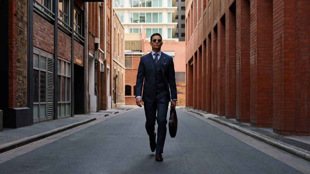 Man in suit for retail videography shoot and TV commercial.