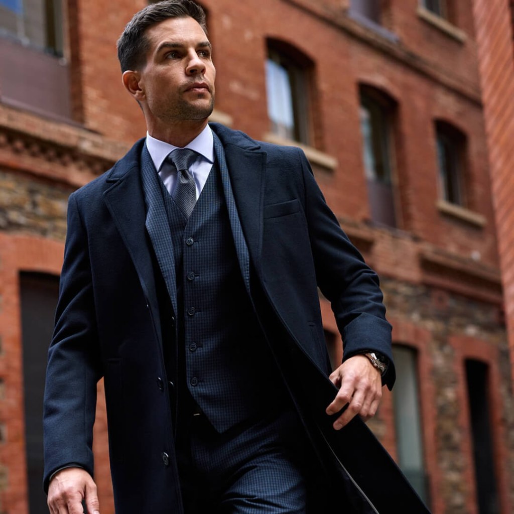 Man in striped suit and overcoat for brand positioning TVC adelaide.