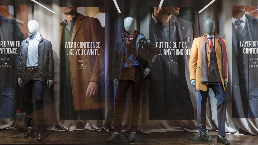 Visual Merchandising and posters in shop window for brand positioning in store execution.